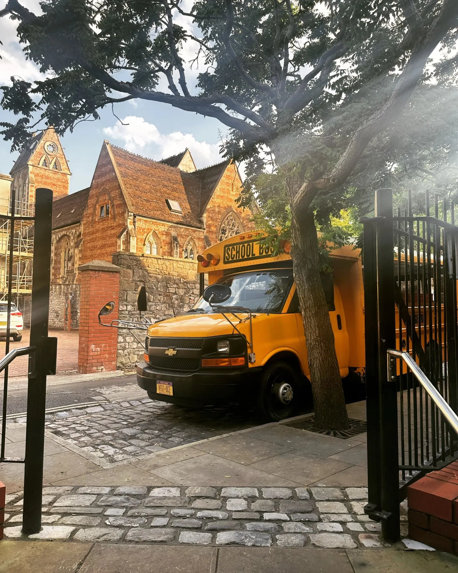 Burger Bus parked by a Victorian red-brick building
